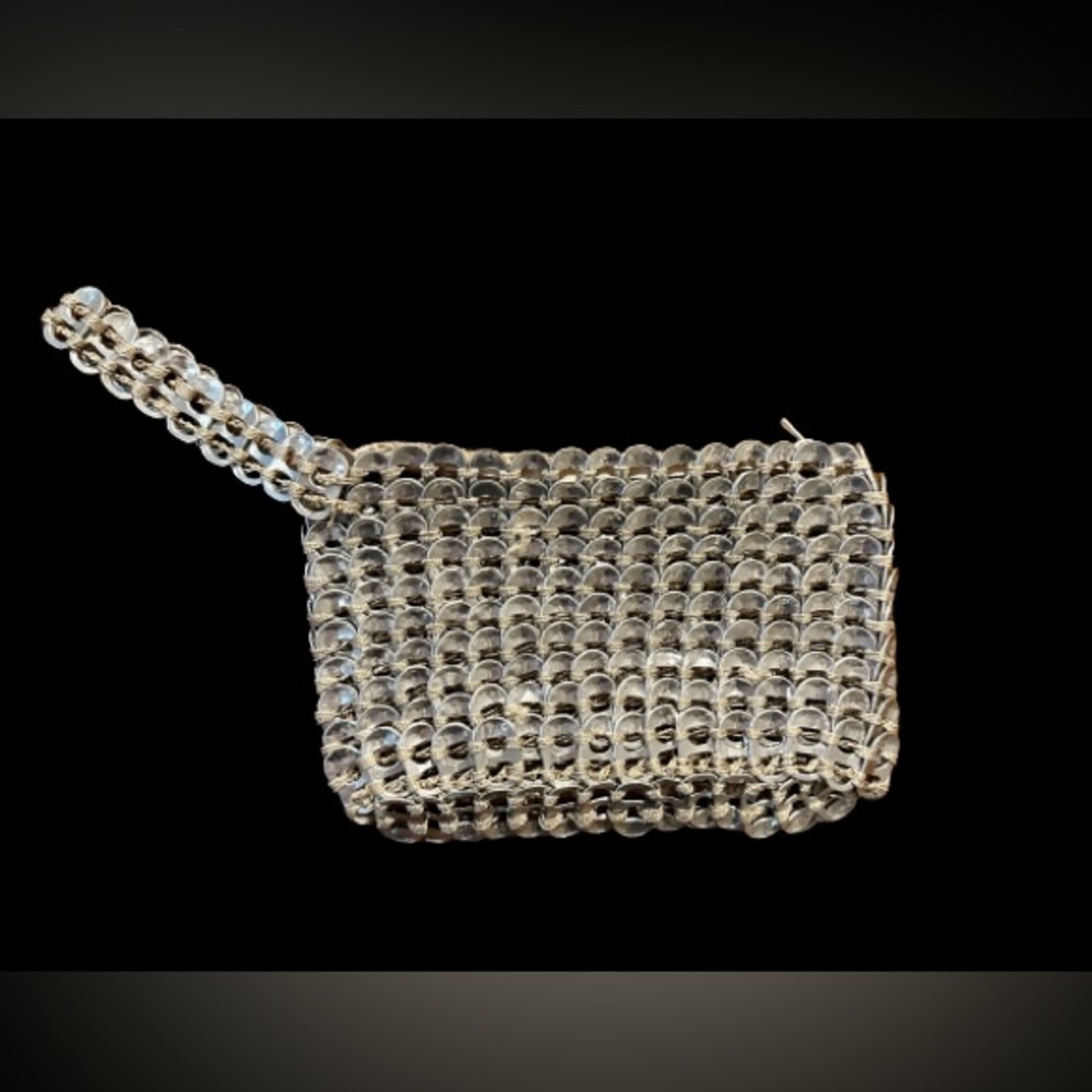 Pop top wristlet purse 8.5” x 4.5”, silver thread, perfect condition.